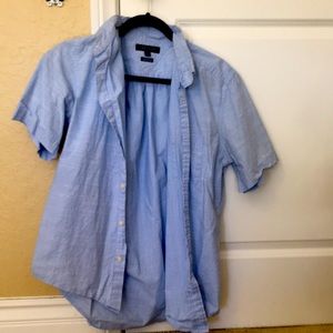 Medium collared dress shirt, business or casual.